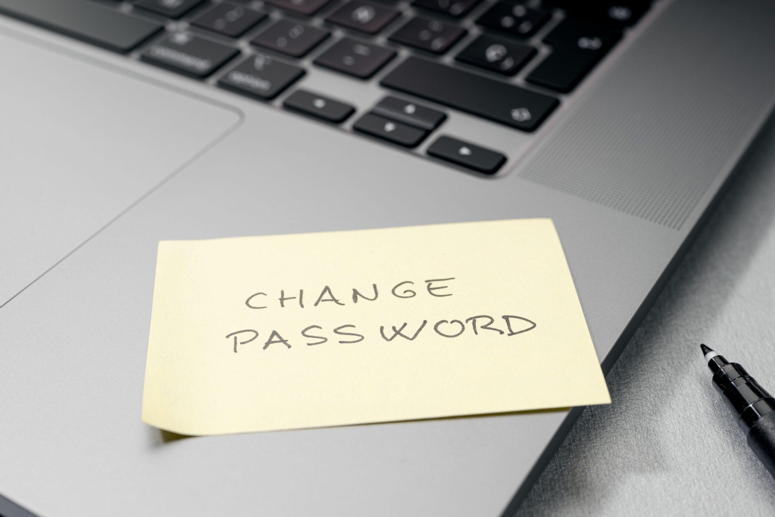 Change password message on sticky note on laptop