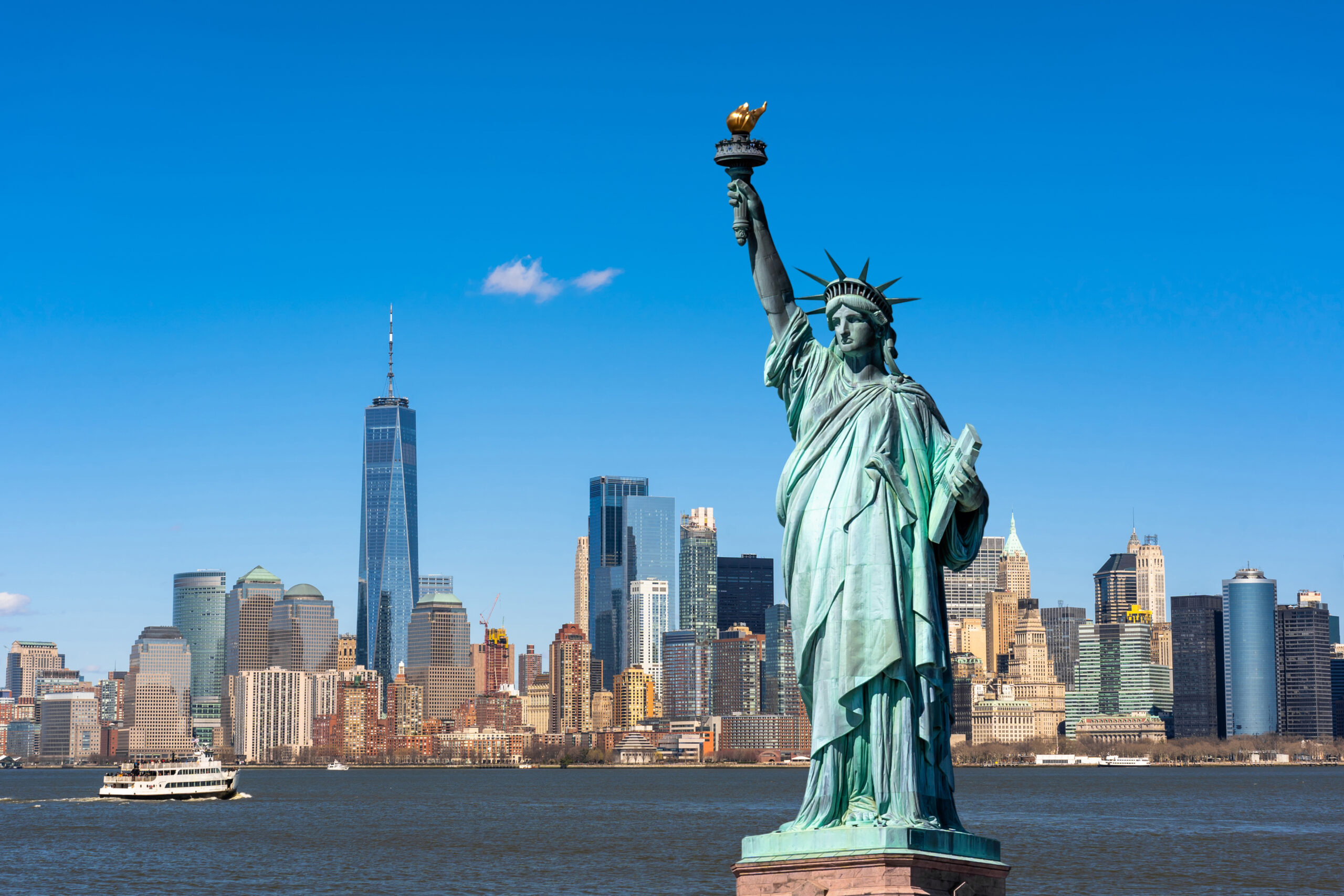 The statue of liberty over the scene of new york cityscape river