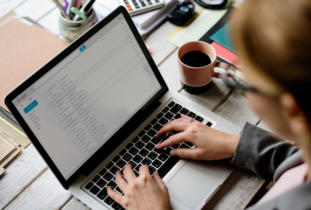 Woman checking her e-mails on a laptop.