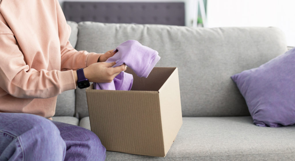 Woman unpacking wrong parcel.