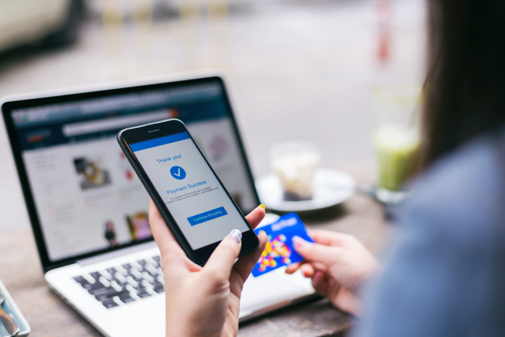 Woman making a successful payment online.