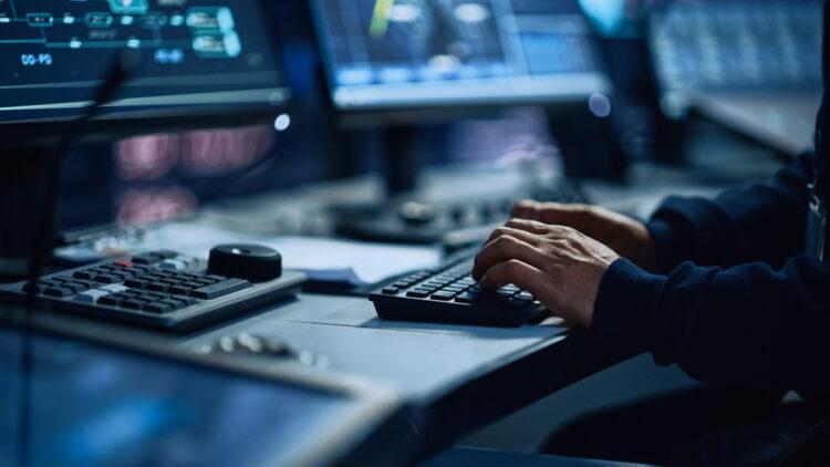 hands of a man working overtime on the computer