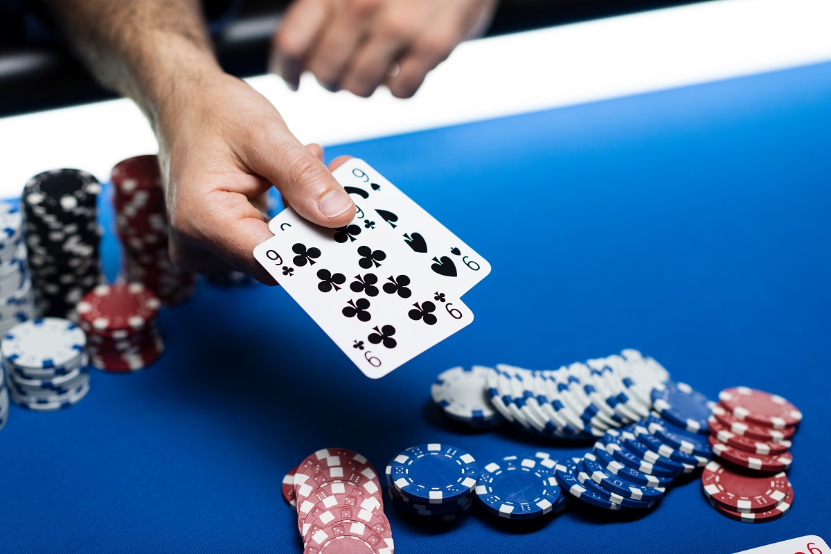man playing poker at casino
