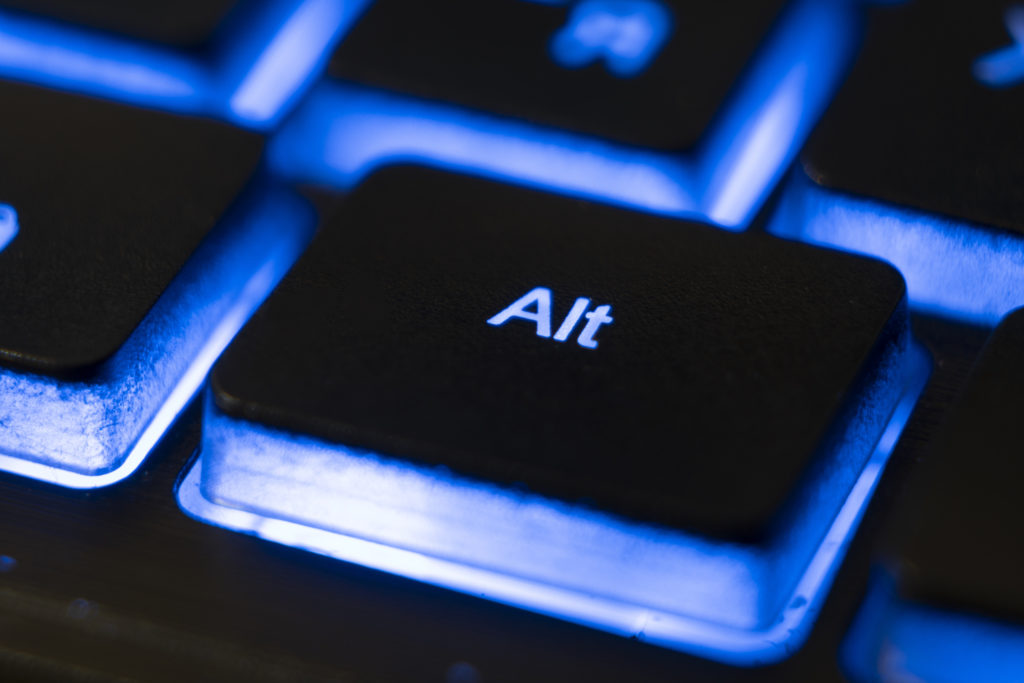 Macro shot of ALT button of a blue keyboard.