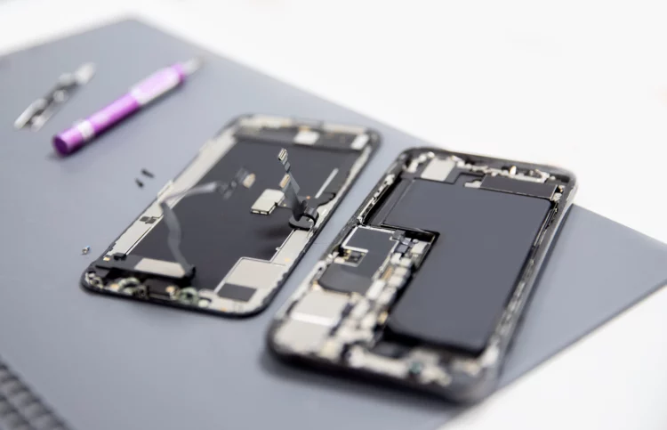 modern mobile phone repair exposing internal parts and battery.