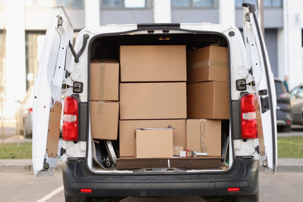 Packages inside delivery van with open door