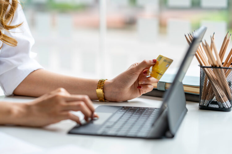 Young woman resting and shopping online at home.