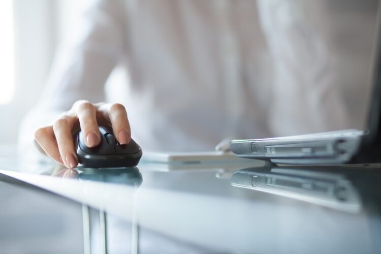 office employee clicking on cordless mouse