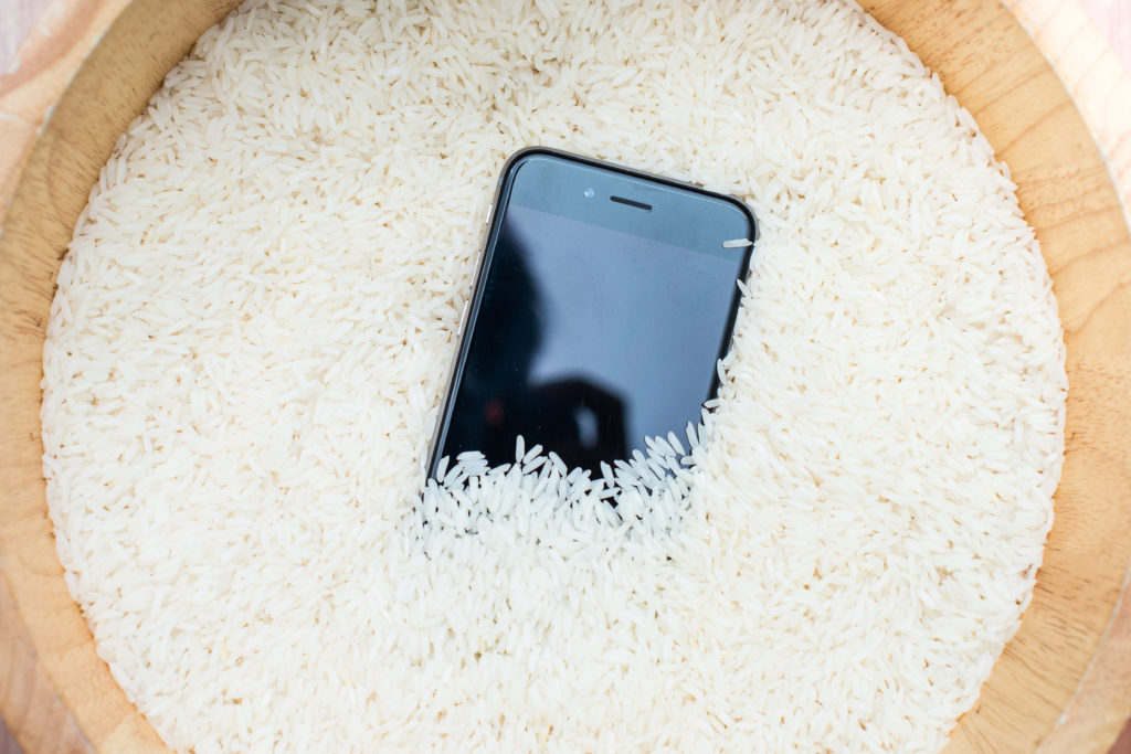 Phone in a bowl of uncooked rice.