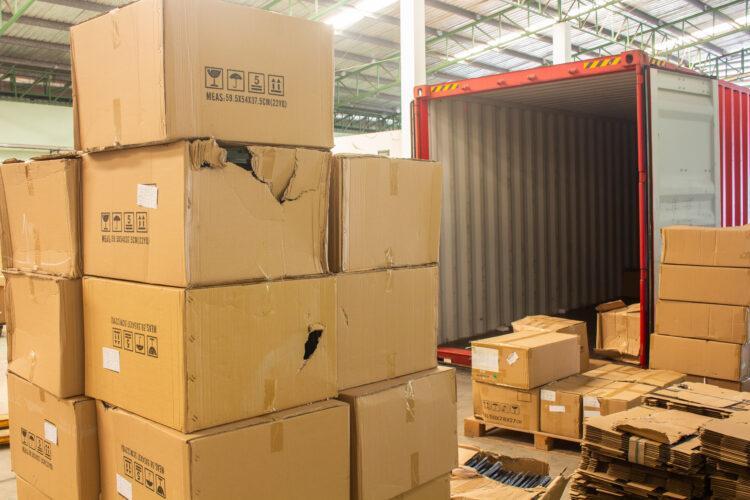 unloading damaged cartons from container