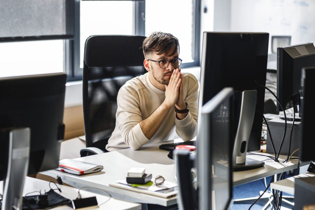 Programmer trying to solve problems with the code he's working on.