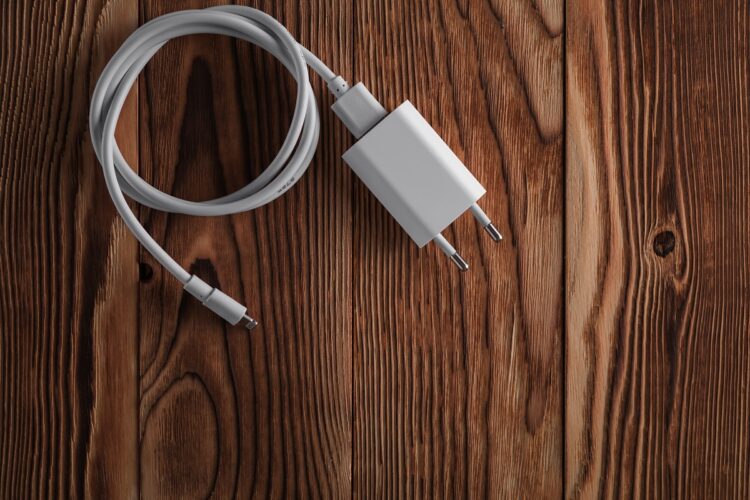  Cable phone chargers on wooden desk