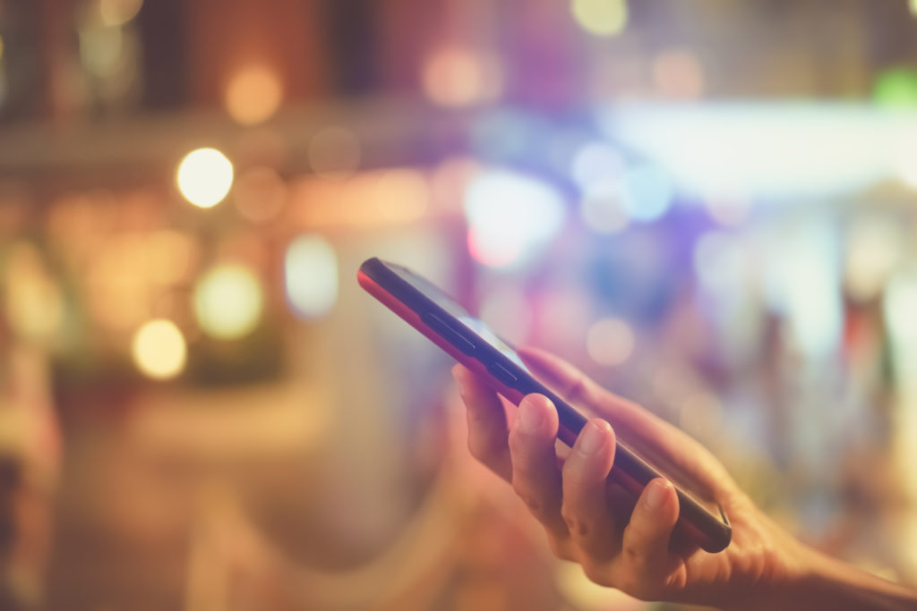 Female hand holding a smartphone.