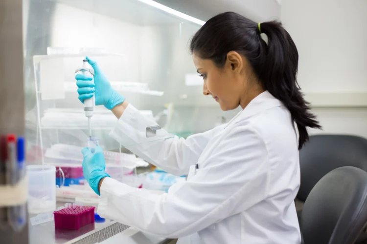 Female scientist working on a research in lab