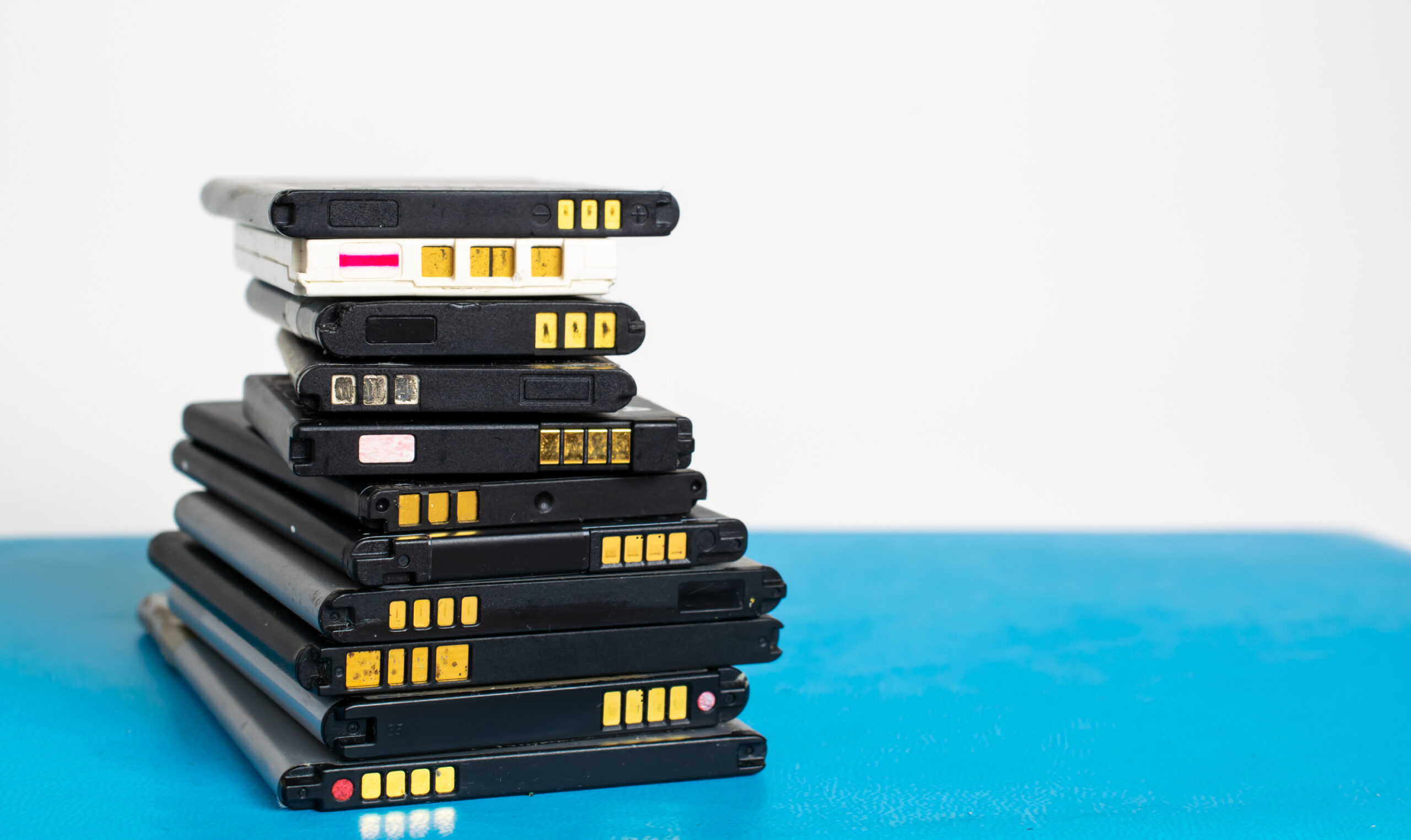 cell phone batteries. stacked. battery recycling. recovery of co