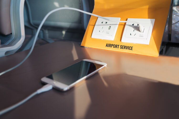 Free electricity plug and USB plug, phone charging station at the airport