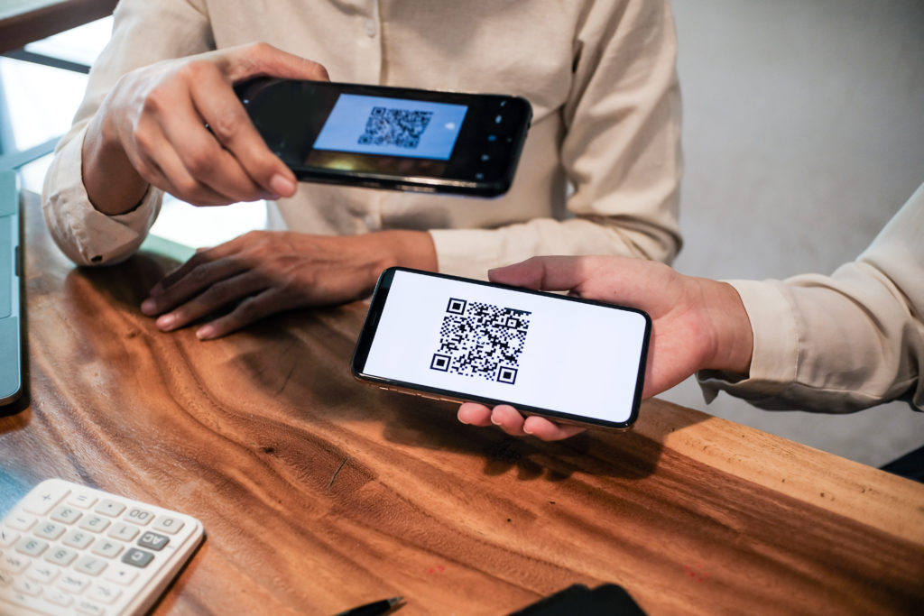 Scanning QR code for cashless payment.