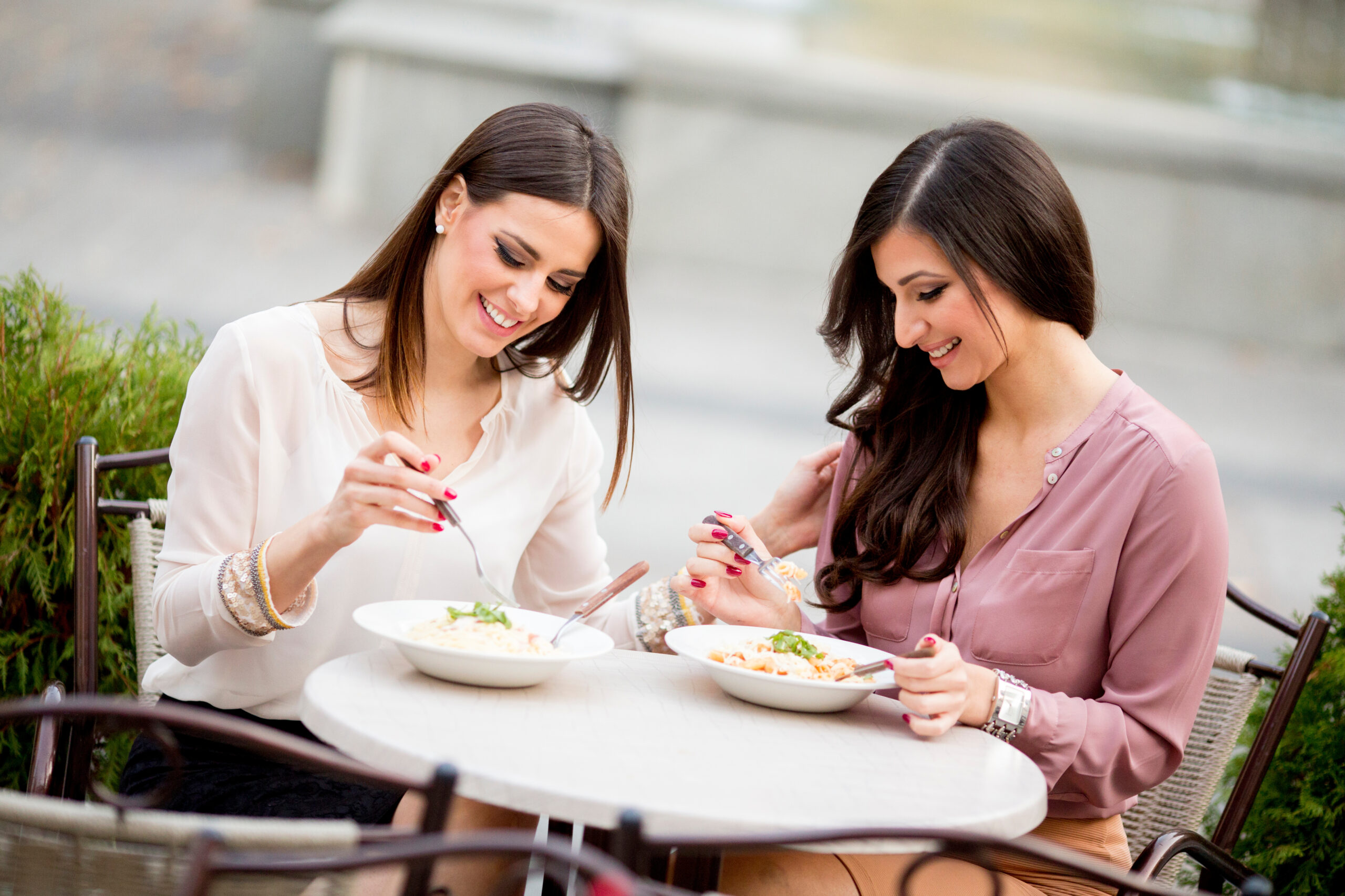 Pretty young women having lunch in the restaurant