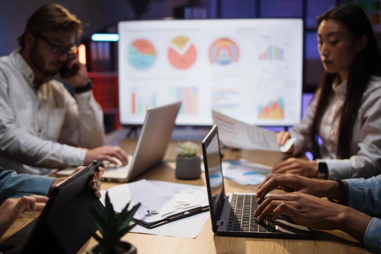 company workers using gadgets at office