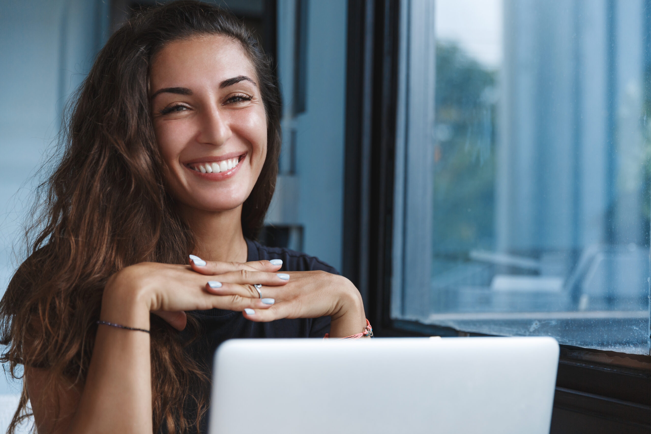 a happy and content-looking woman shows personal growth and development