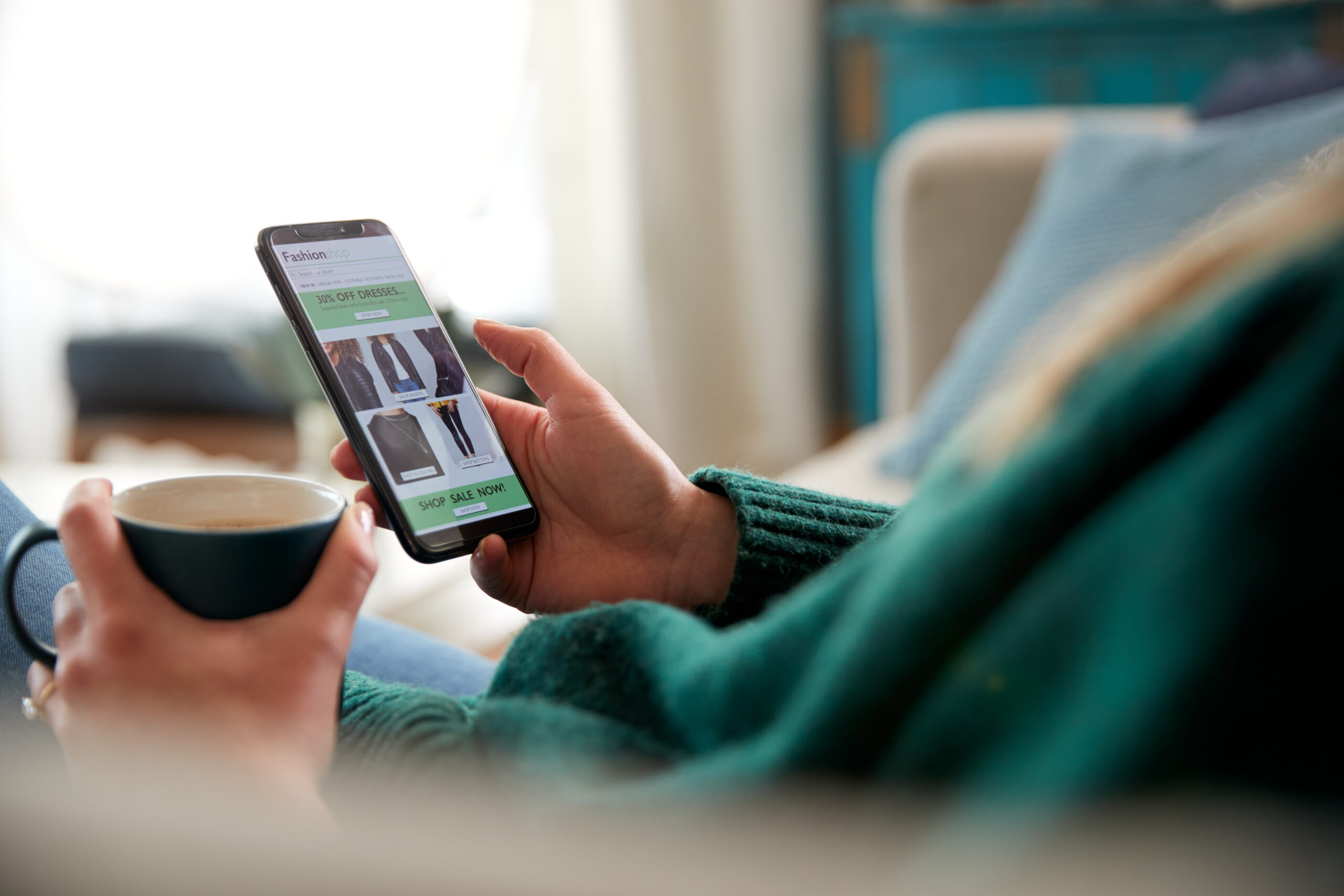 woman shopping for clothes on phone app