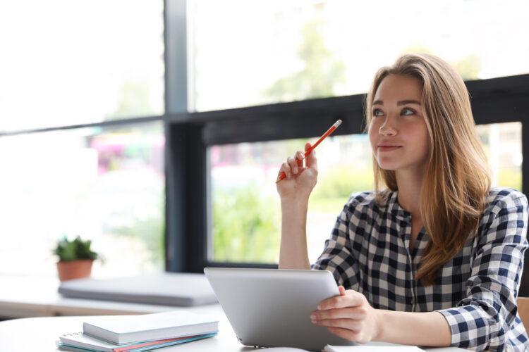 Pensive young woman thinking about her options and about to make a decision