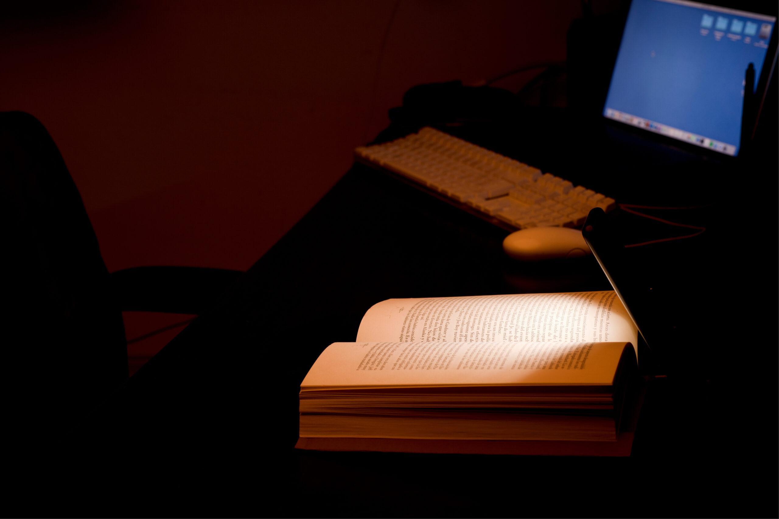 cell phone and power bank on the desk illuminates reading and st