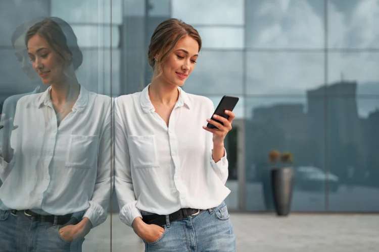 woman business person standing outdoor while using cellphone