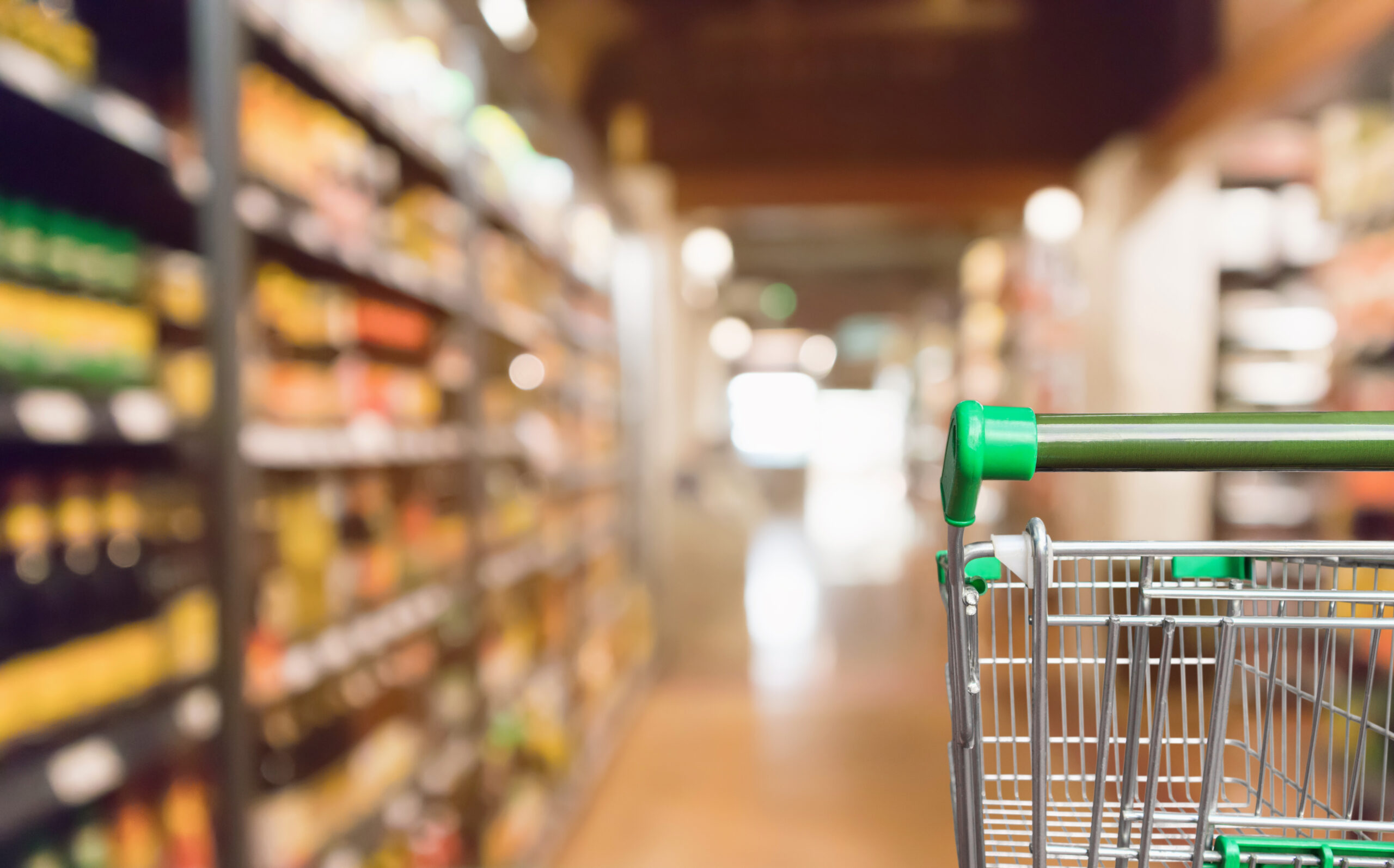 empty supermarket shopping cart in a grocery store