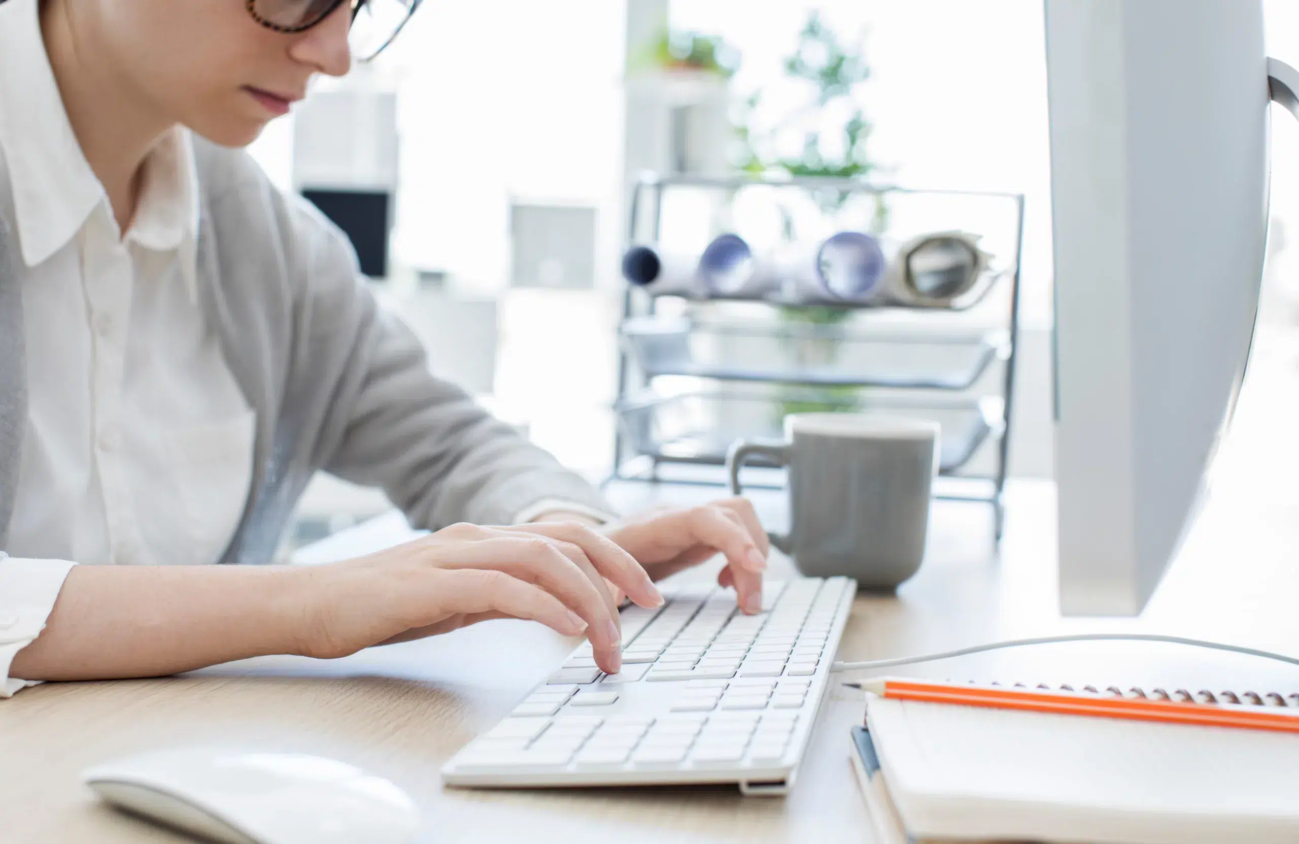 Woman typing on keyboard