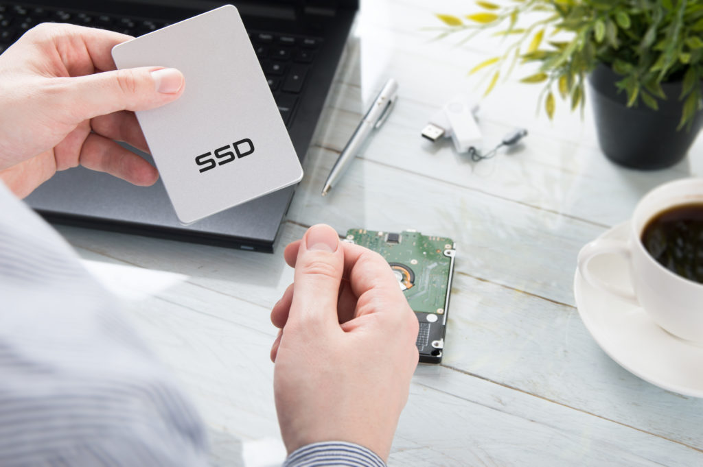 Man holding a modern SSD disk.