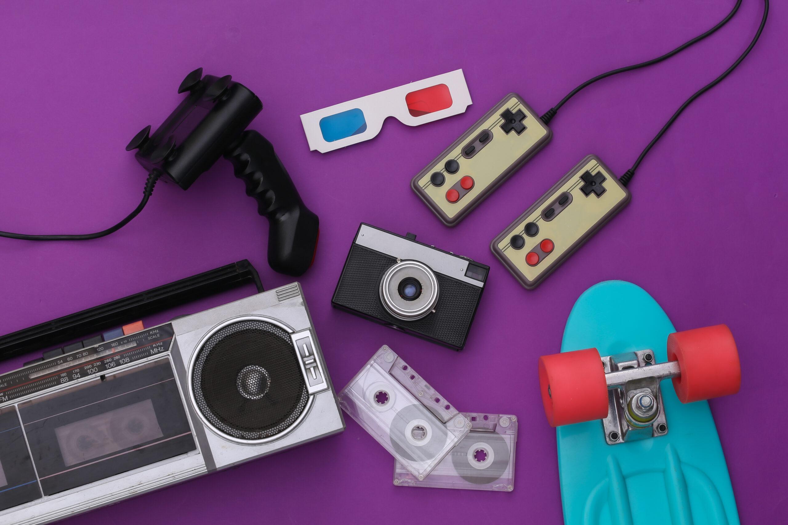 Retro old school attributes 80s on purple background. Top view. Flat lay