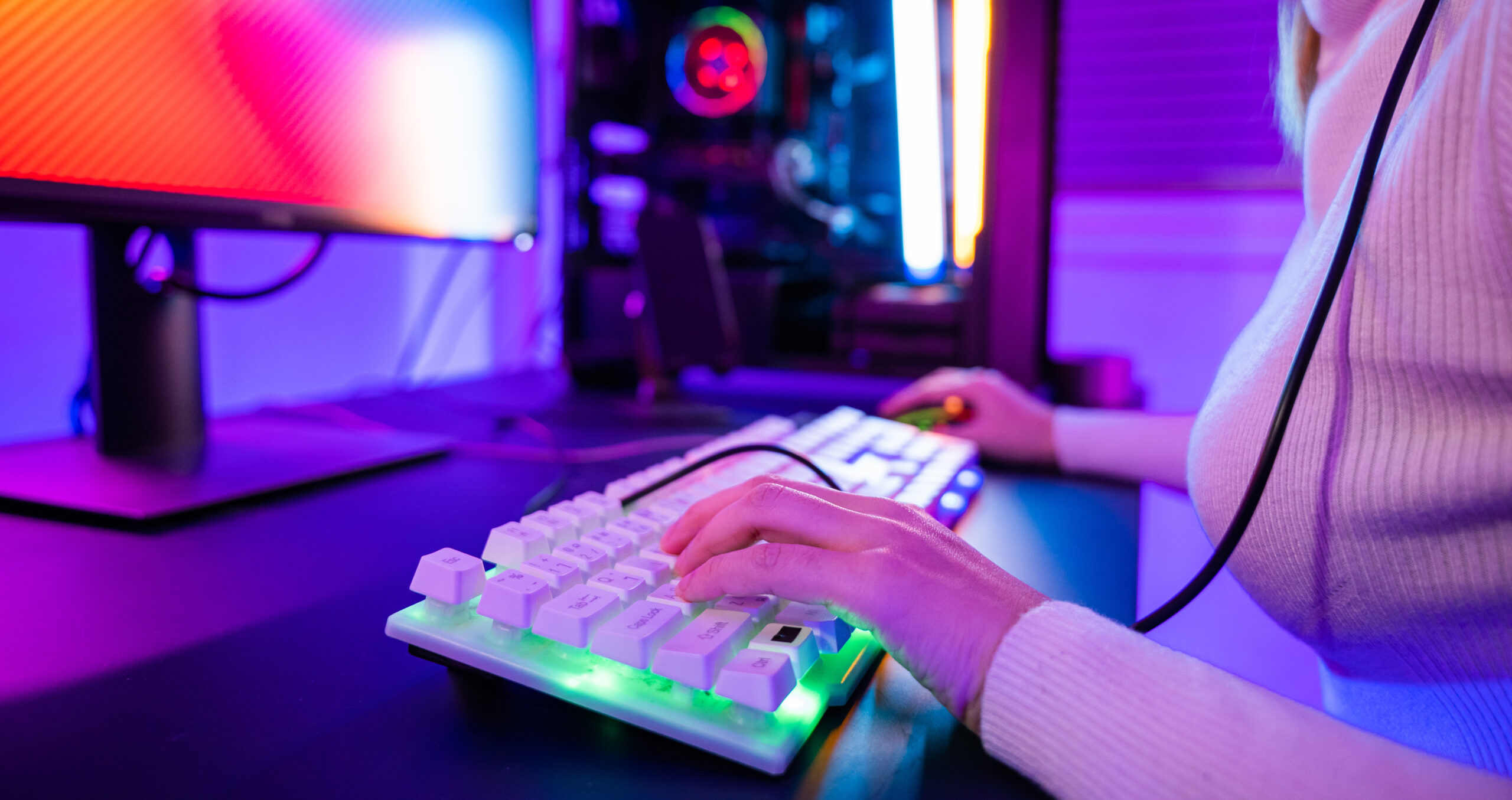 close up of woman's hands typing on keyboard