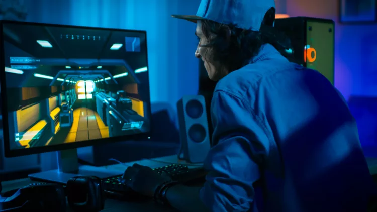 Excited Gamer Playing First-Person Shooter Online Video Game on His Powerful Personal Computer 