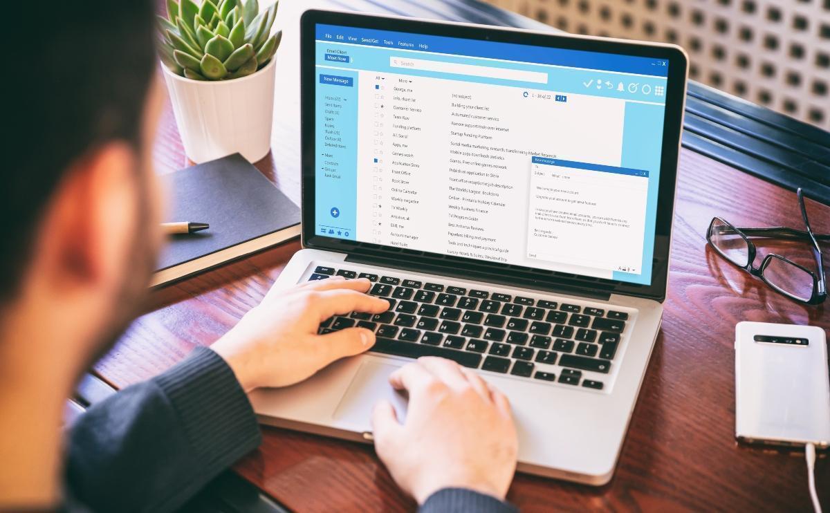 Man checking messages in his email inbox