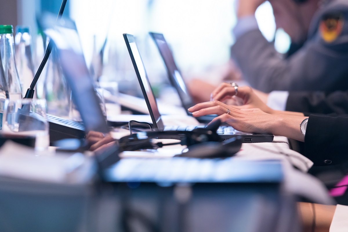 office workers using laptop computer