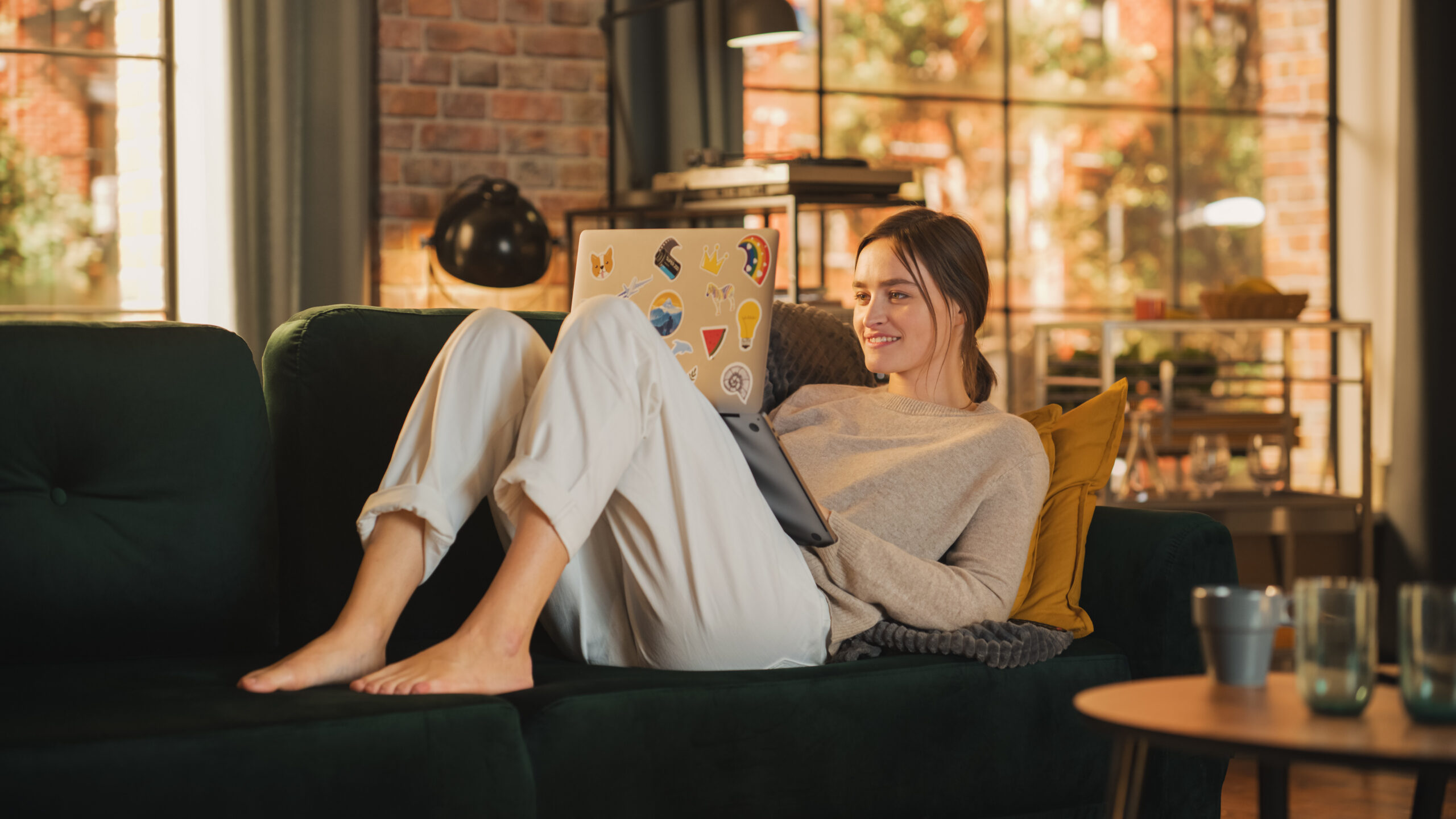 Young Beautiful Woman Lying Down on Couch, Use Laptop Computer i