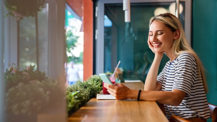 happy woman using mobile phone for social media.