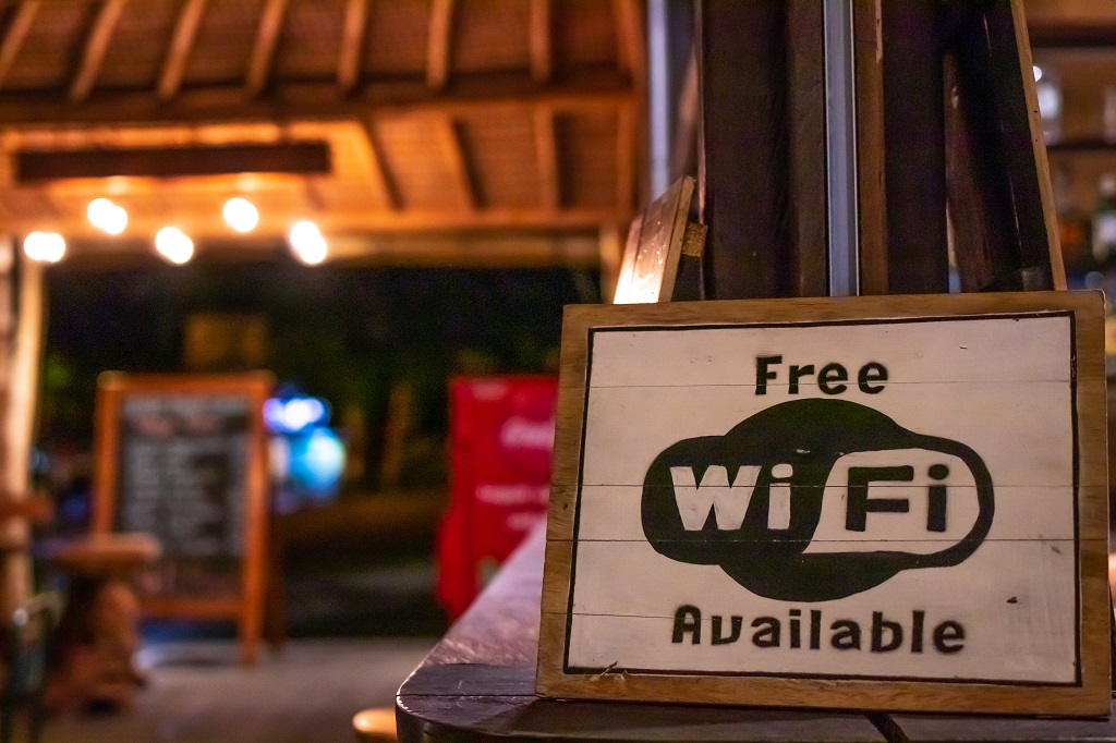 Free wifi sign wooden board in restaurant