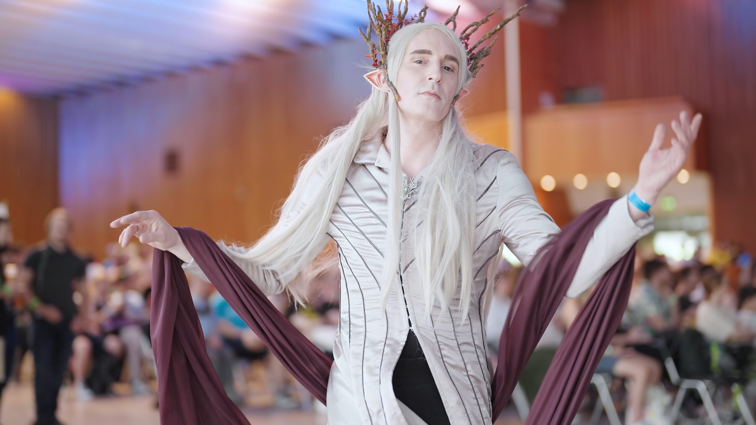 Fan wearing Thranduil Elven king  costume from LOTR posing for camera at a cosplay event