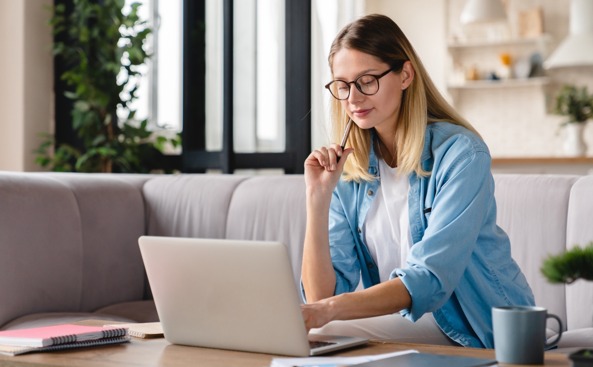 Young caucasian multitasking businesswoman working from home remotely