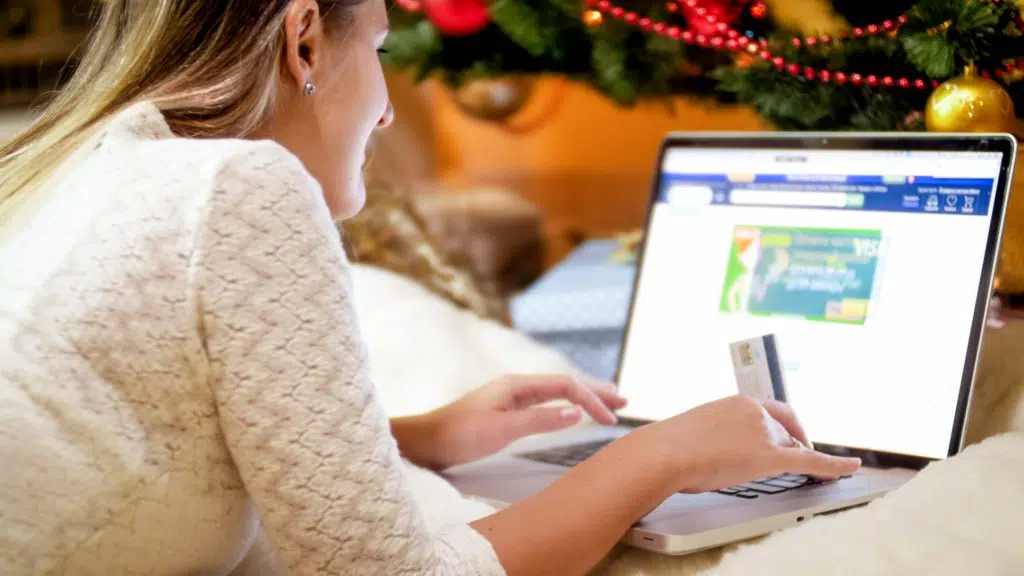 Woman ordering Christmas gifts online.