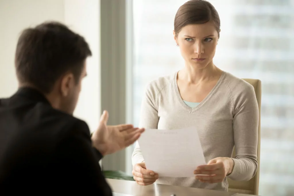 Man trying to convince doubtful female client.