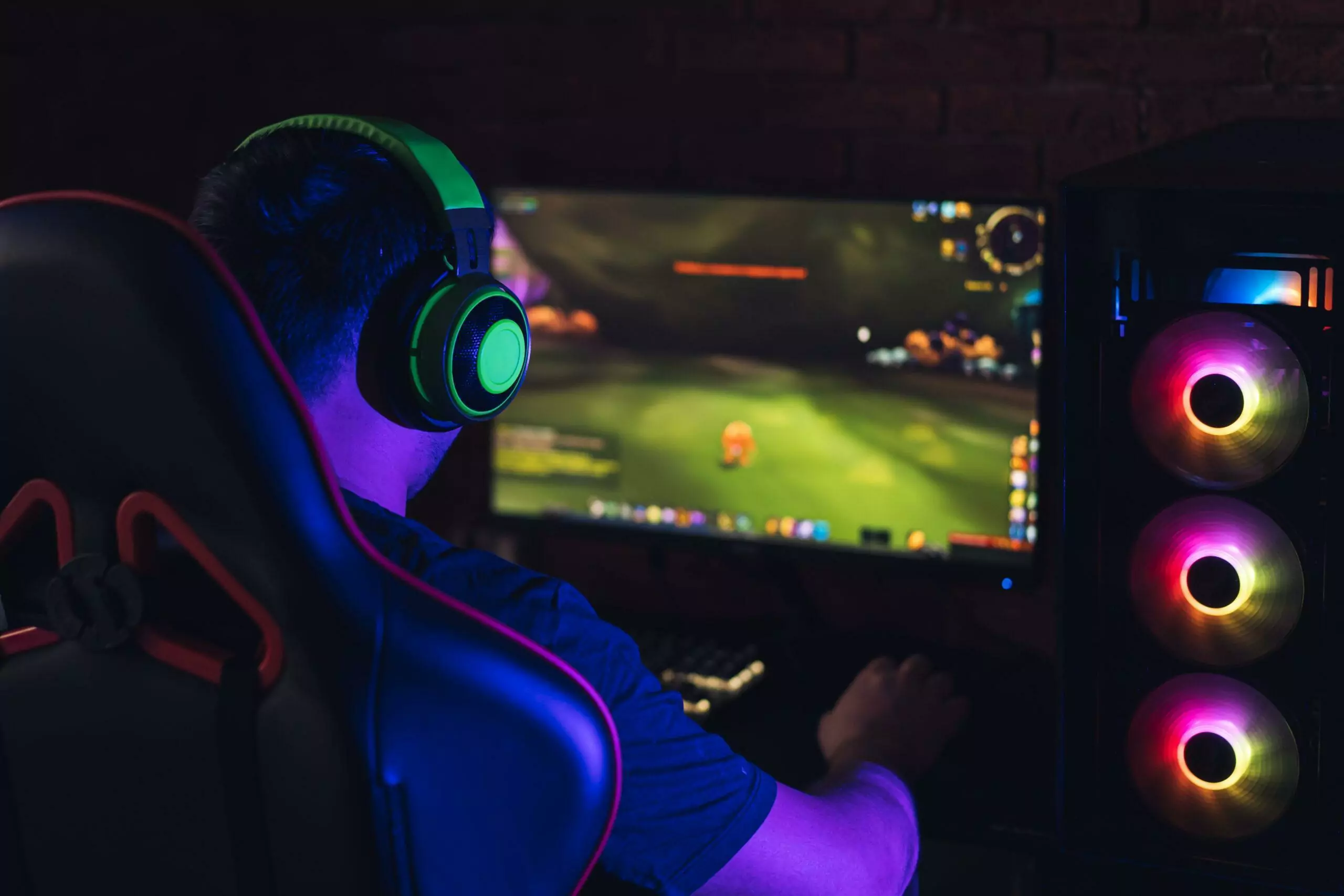 Male with headphones giving his full attention on game