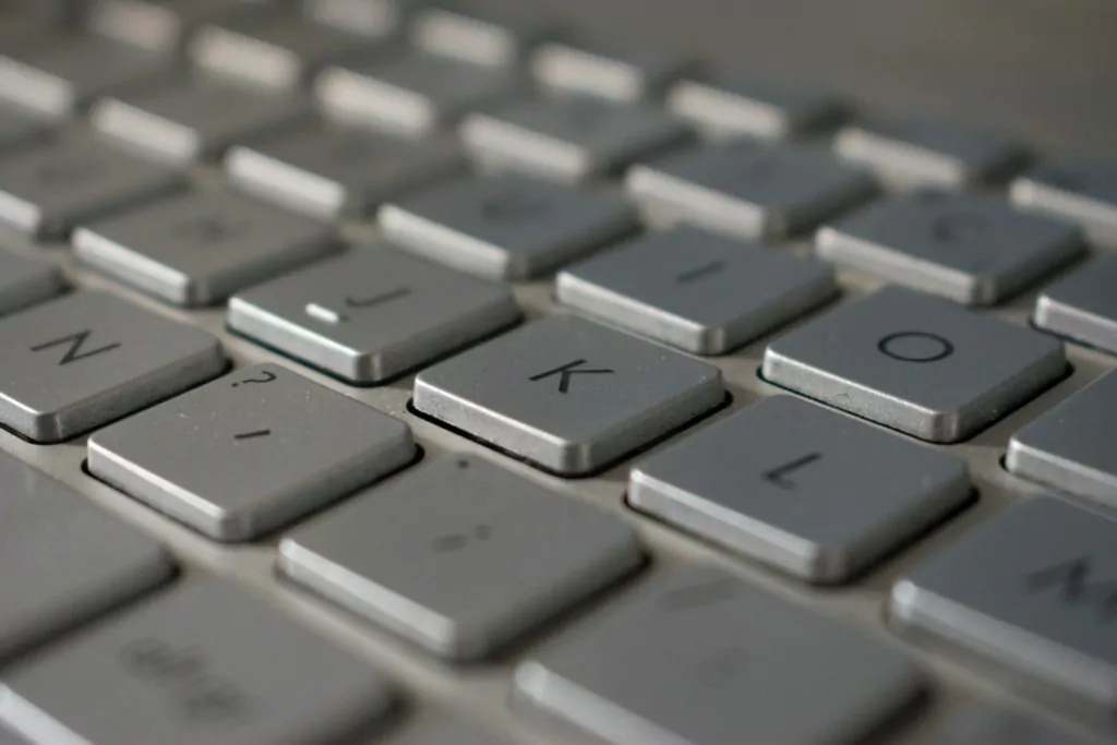 Close-up of computer keyboard with focus on the letter K.
