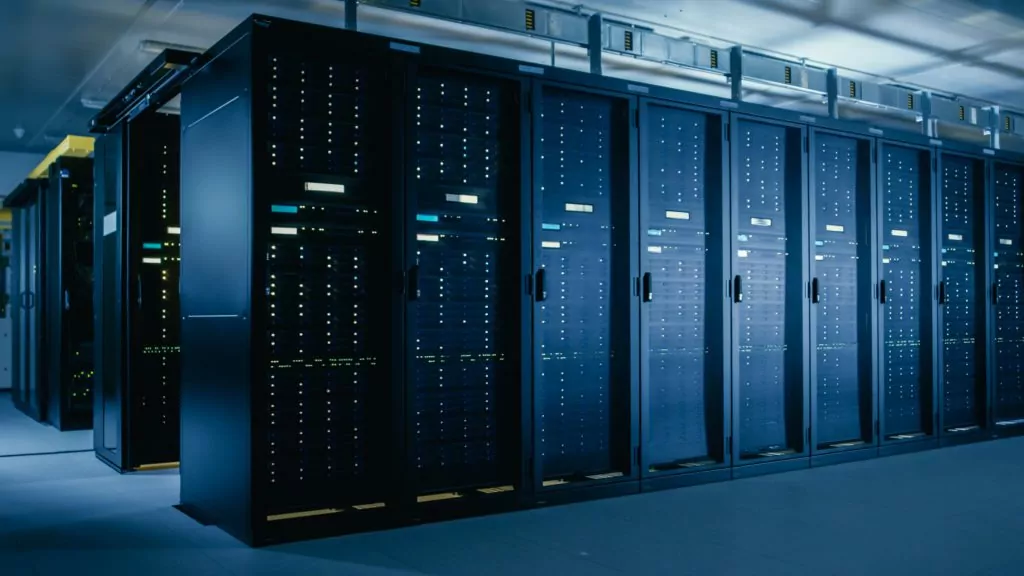 Data center with multiple rows of server racks.