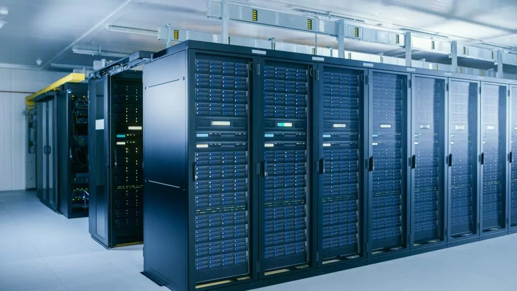 Shot of data center with multiple rows of server racks.