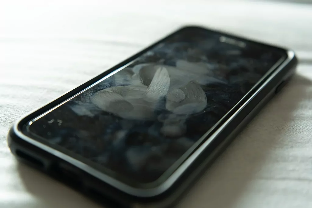 Smartphone with dirty marks on touchscreen.