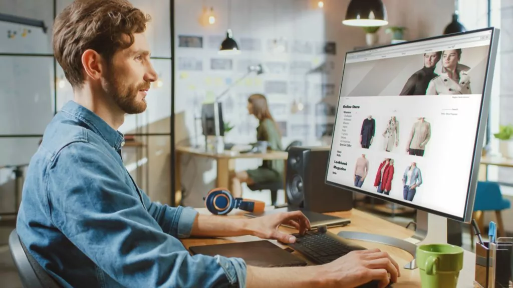 Man scrolling through an online fashion store website.