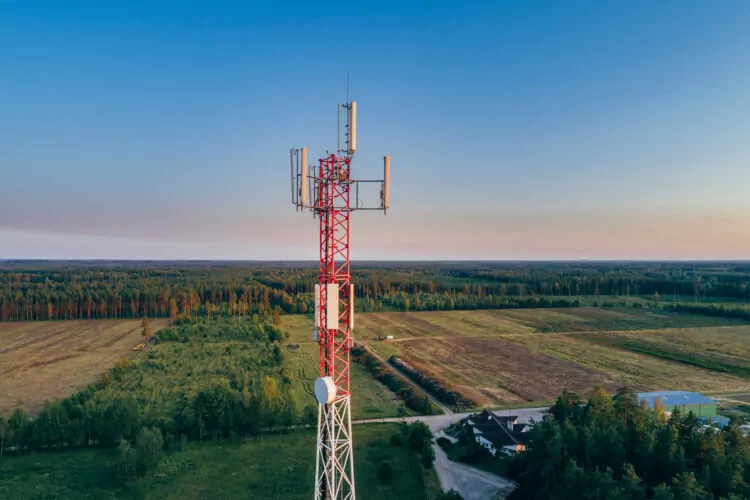 Mobile communication tower during sunset from above.